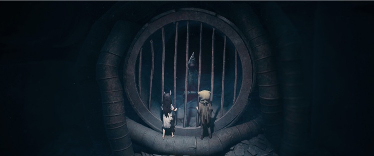 Dos criaturas observan a través de una puerta circular enjaulada